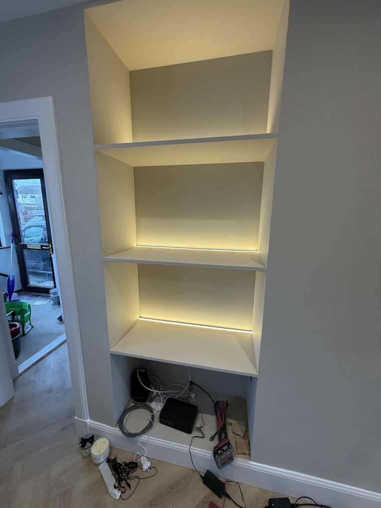 LED-lit built-in alcove shelving installation