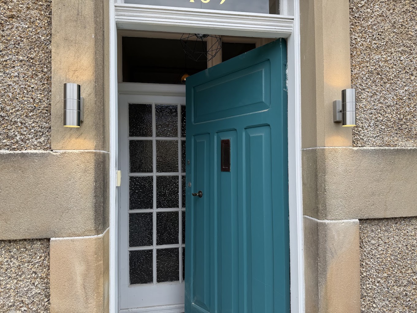 New exterior up/down wall lights at front door