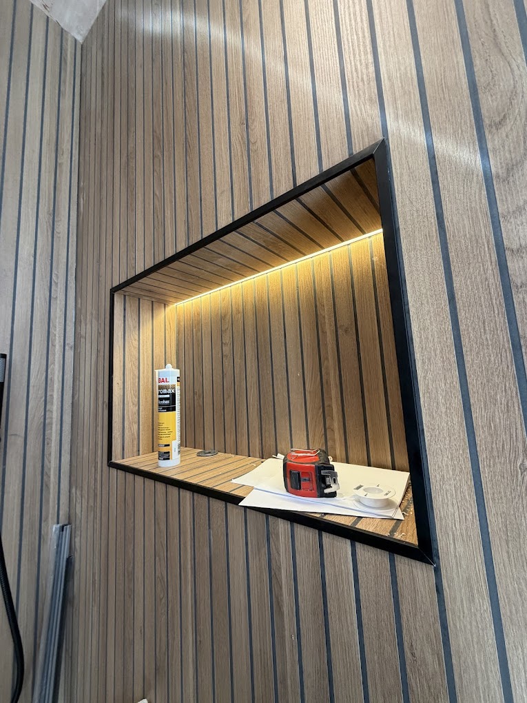LED-lit feature niche in wood panelling